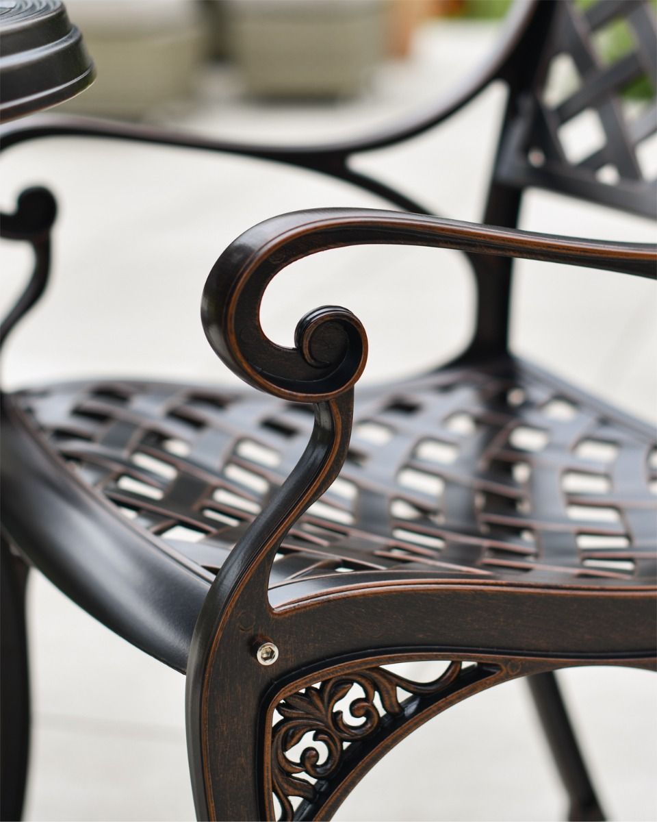 Scroll Arm Rest on Copper Chair 