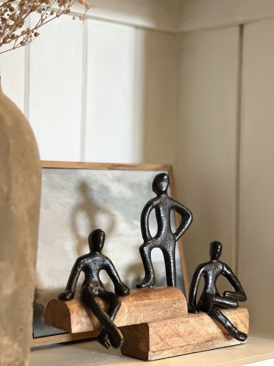Angled view of aluminium and mango wood home accessory