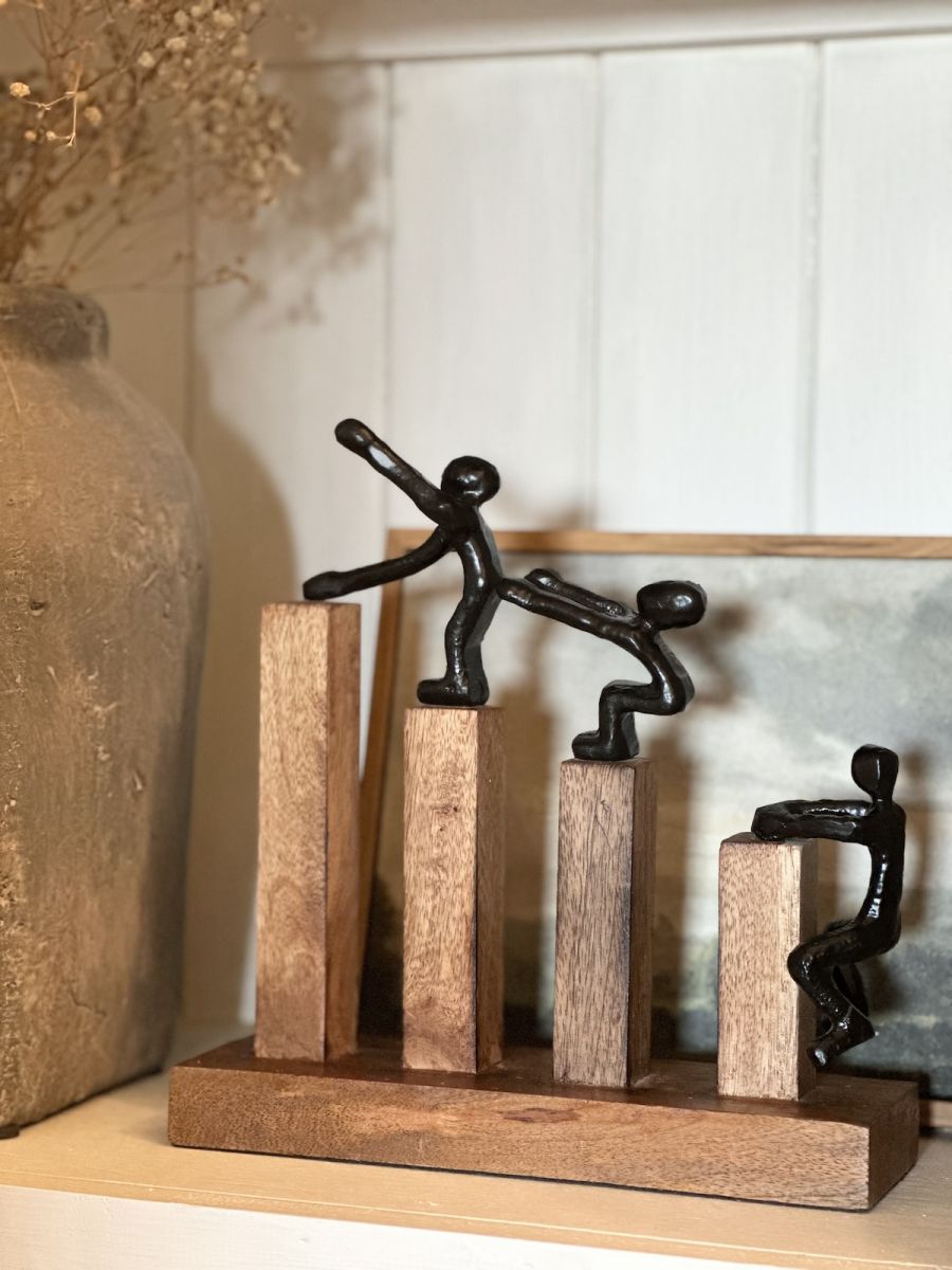 Angled view of black figure on home accessory