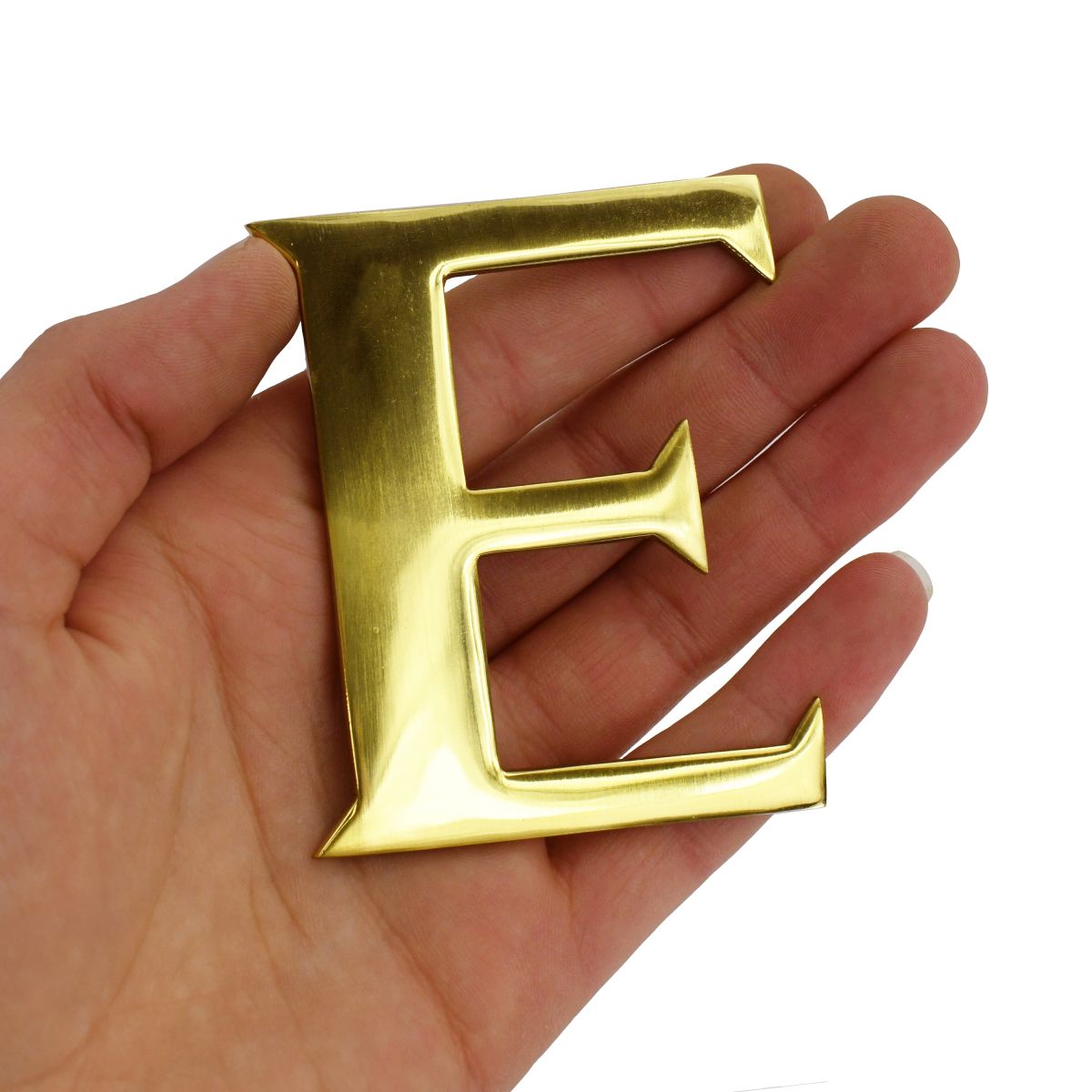 Polished Brass Letter "E" in hand