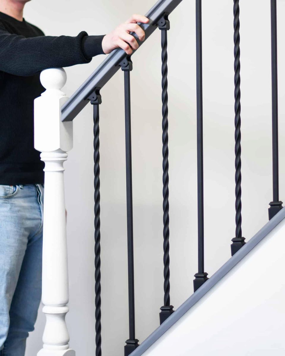 Scale Shot of Set of 2 Matte Black "Enfield" Steel Stair Spindles - Pattern 11