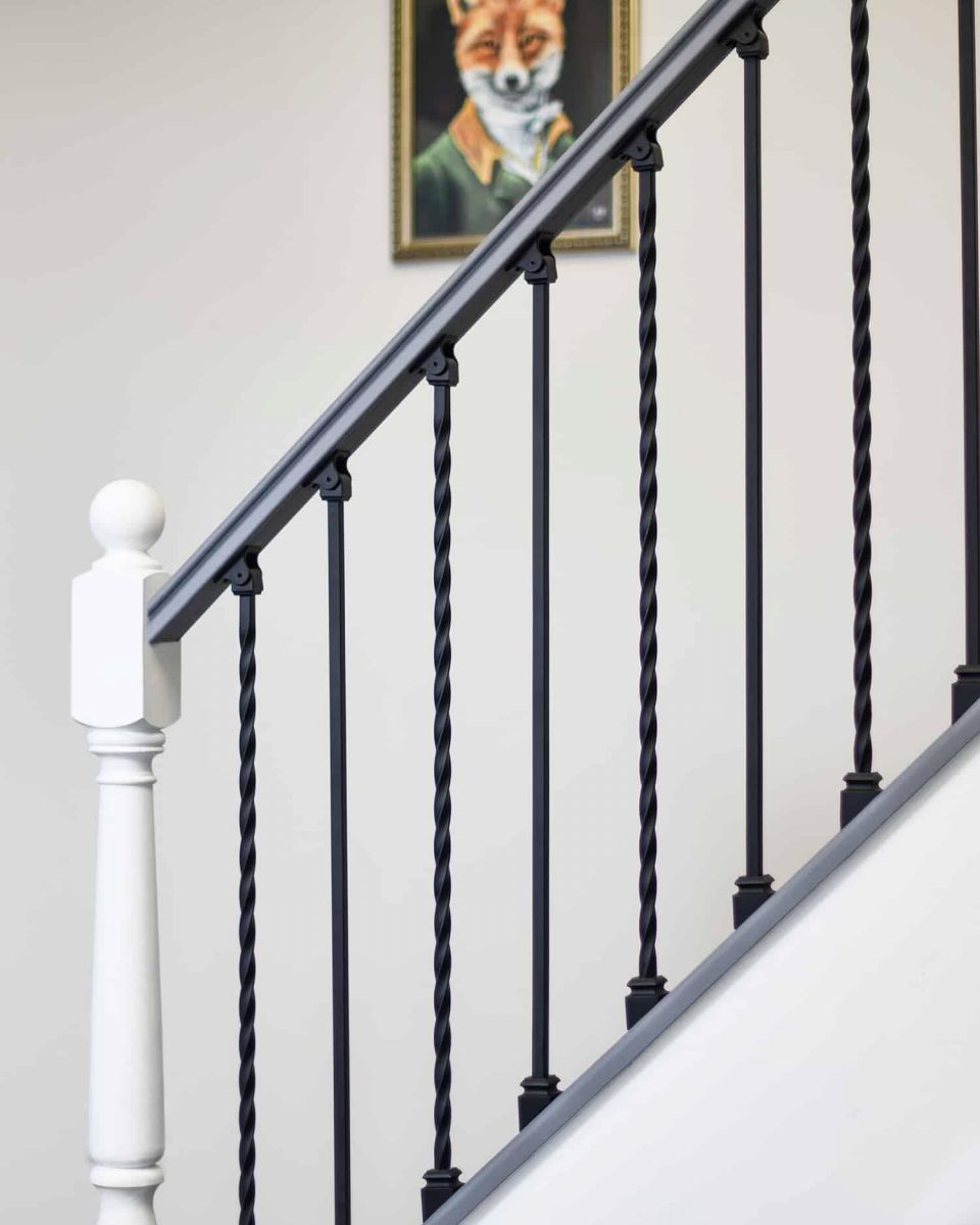 Set of 2 Matte Black "Enfield" Steel Stair Spindles - Pattern 11 in Situ