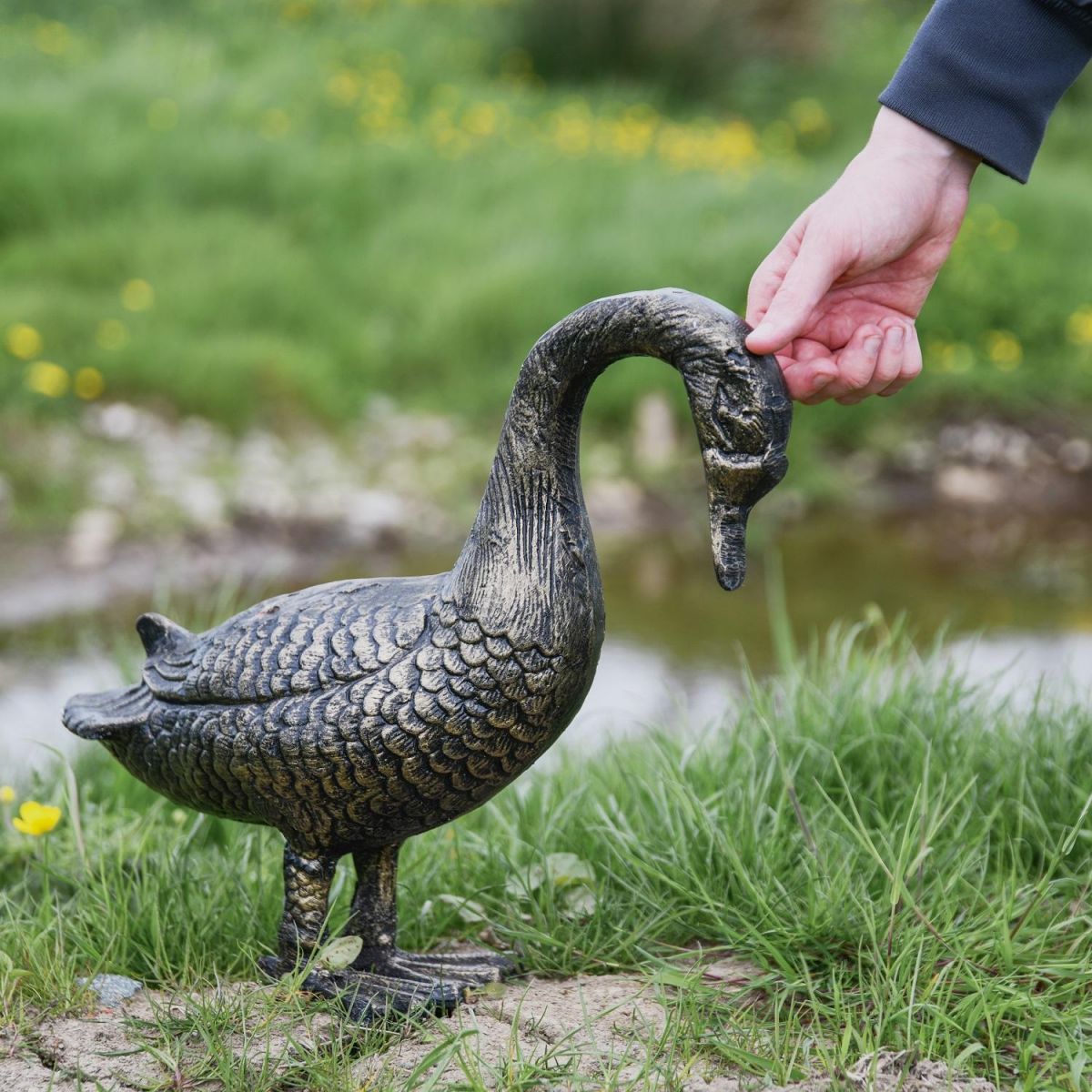 Brushed Gold Goose Sculpture with Hand for Scale 
