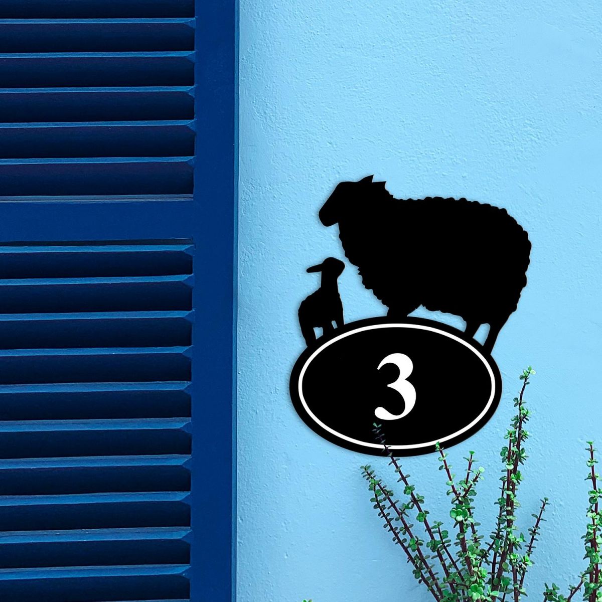 Sheep & Lamb Iron House Number Sign on a Blue Wall