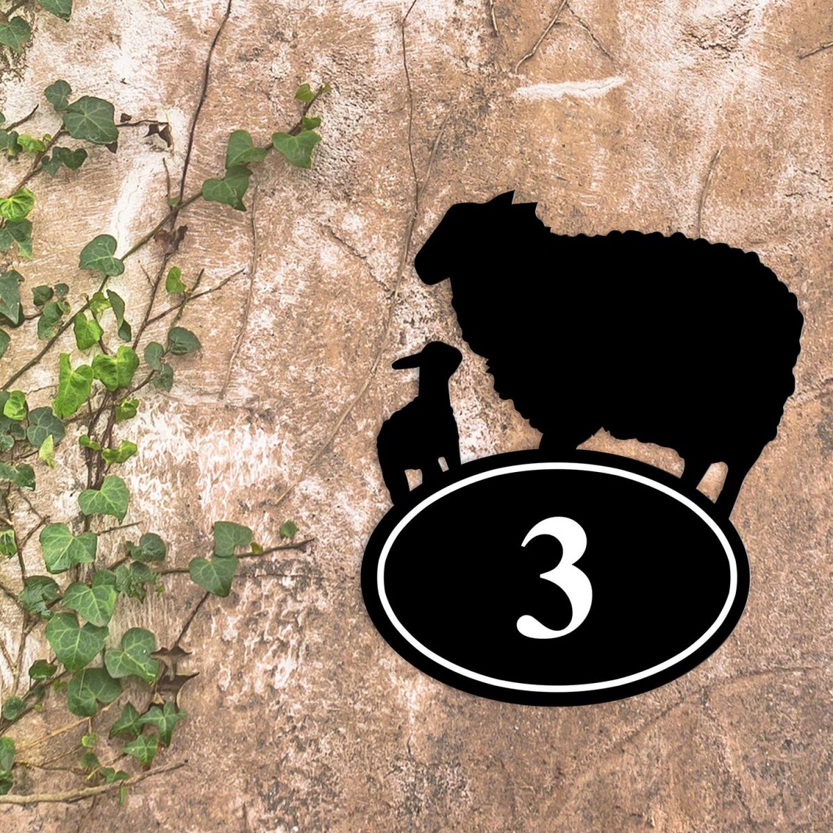Sheep & Lamb Iron House Number Sign in Situ on a Rustic Wall 