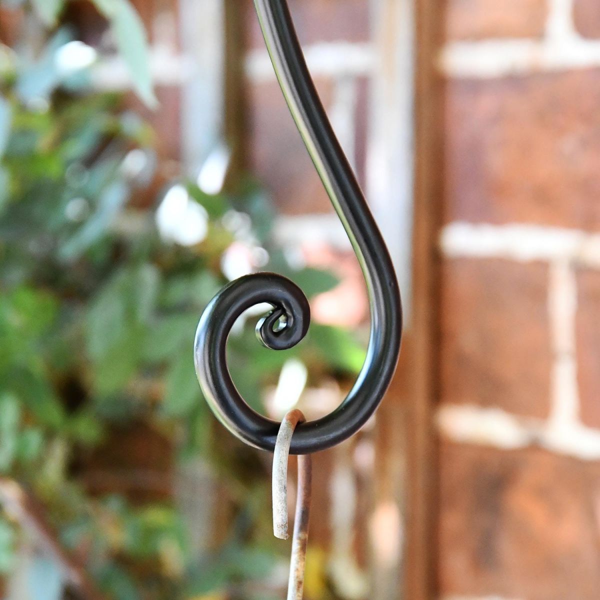 Close-up o fthe Curved Scroll Design Holding a Hanging Basket