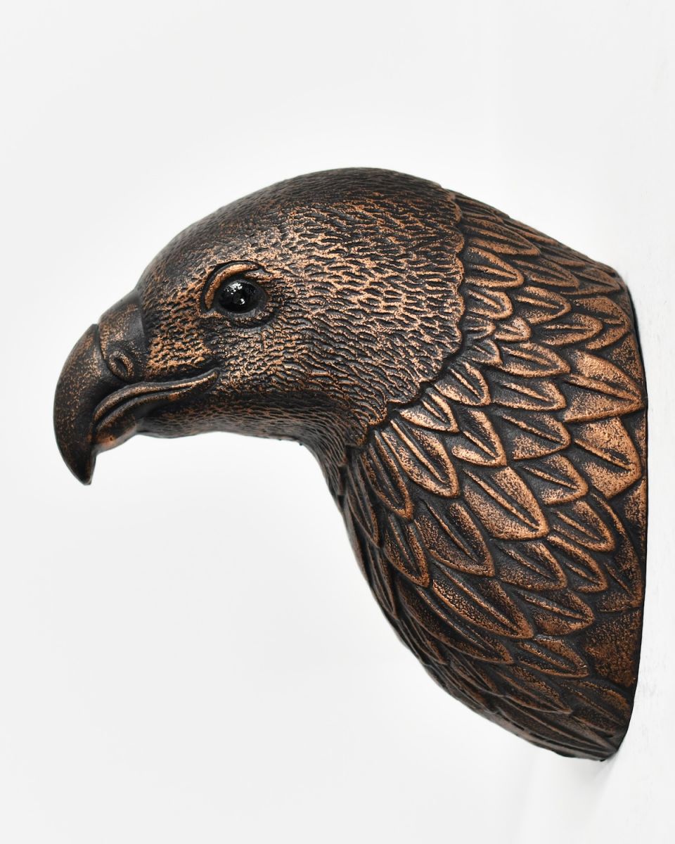 Side view of copper animal wall bust