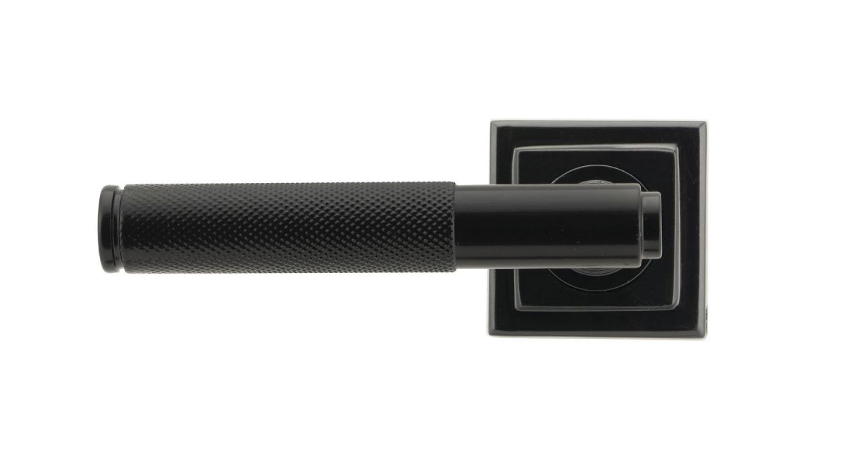 Sleek Black Textured Unsprung Lever Door Handle on Square Rose