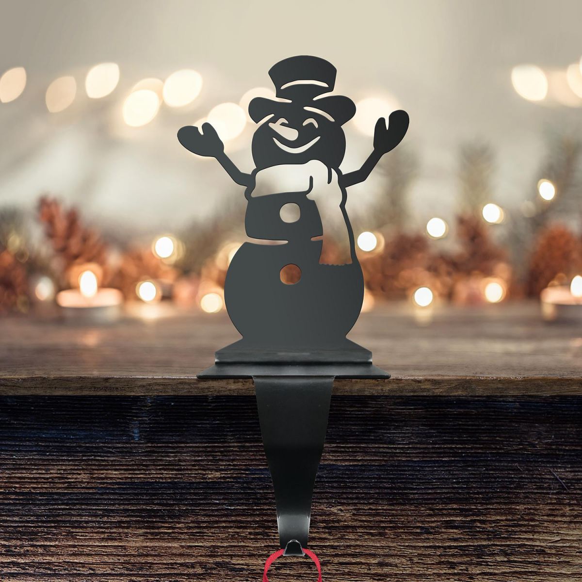 Snowman Stocking Holder in Situ on a Mantel Piece 