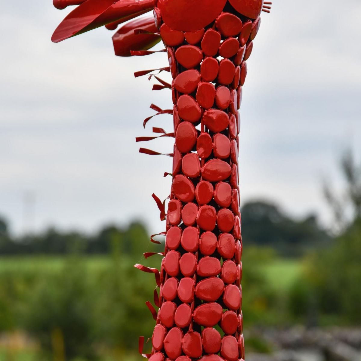 Close-Up of Steel "Lady Jengo" Baby Giraffe Sculpture - Red