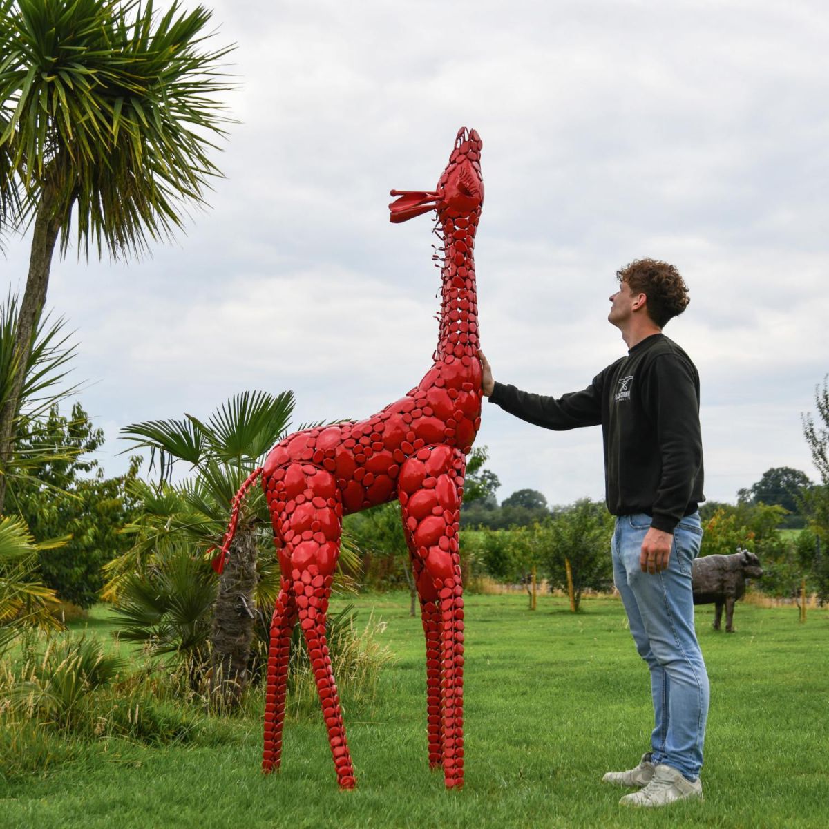 Scale Shot of Steel "Lady Jengo" Baby Giraffe Sculpture - Red