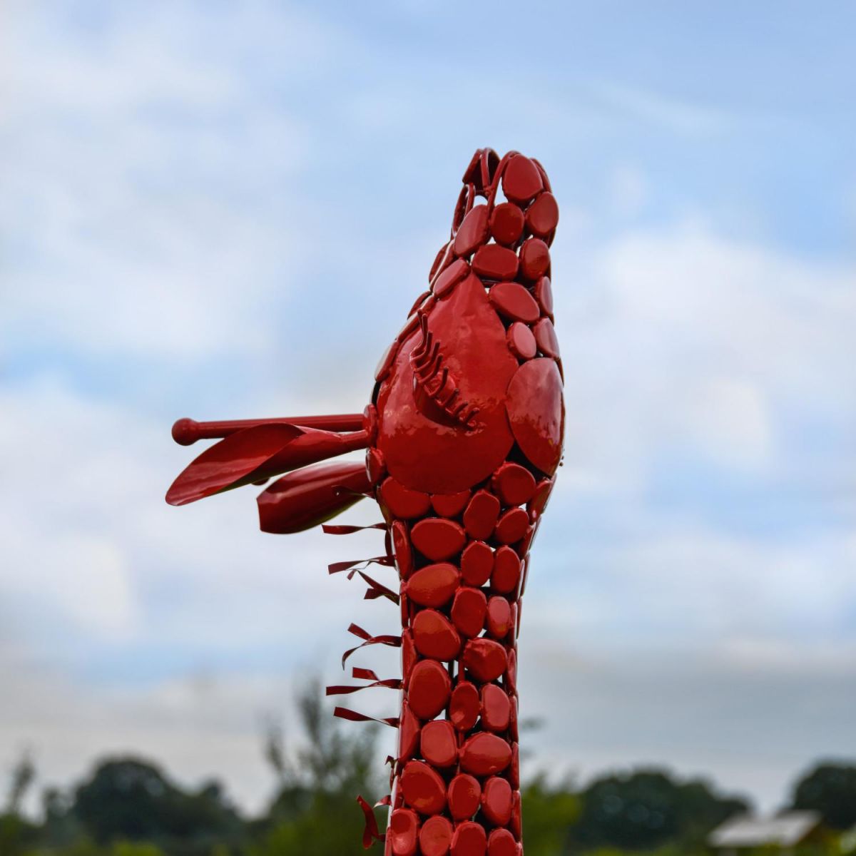 Close-Up of Red "Lady Jengo" Baby Giraffe Sculpture