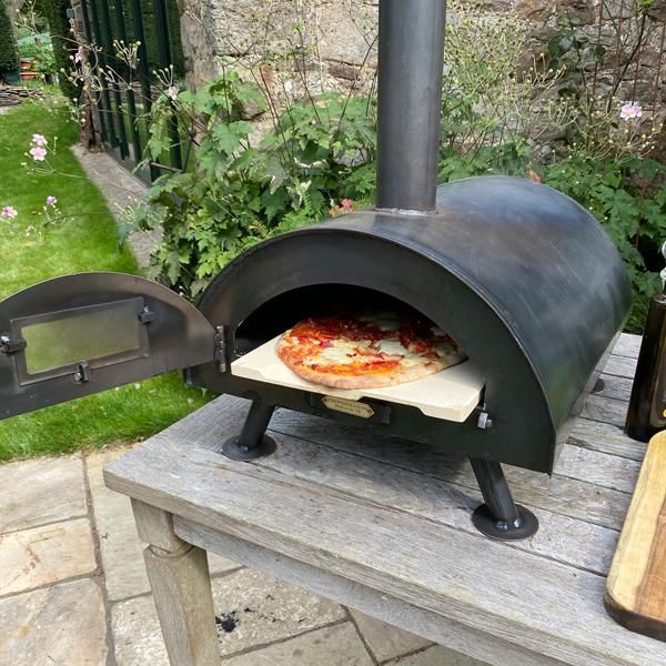 Steel Table Top Pizza Oven in Use Cooking a Pizza