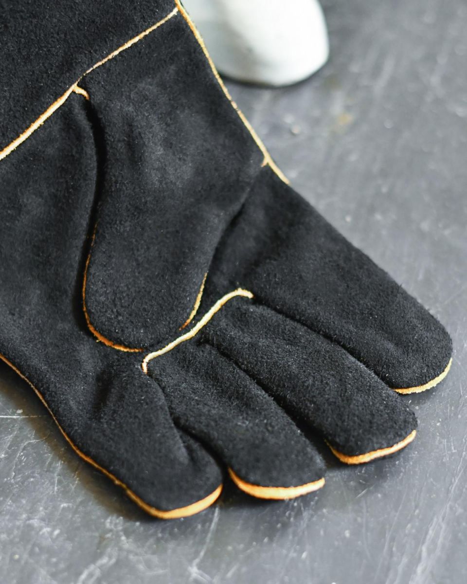 Close Up Of Suede Black & Orange Fireside Gloves Fingers