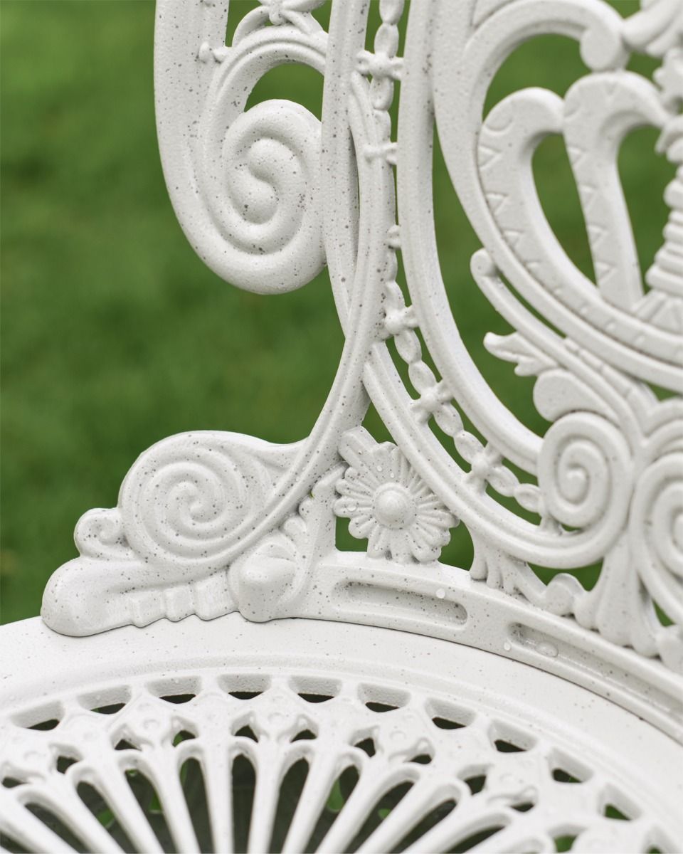 Close Up of Flower and Scroll Design on Cast Aluminium Chair 