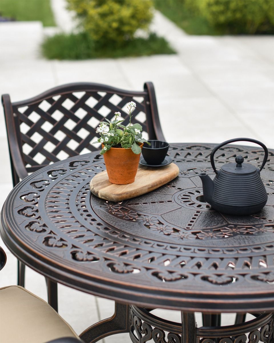 Ornate Table with Teapot and Plant 