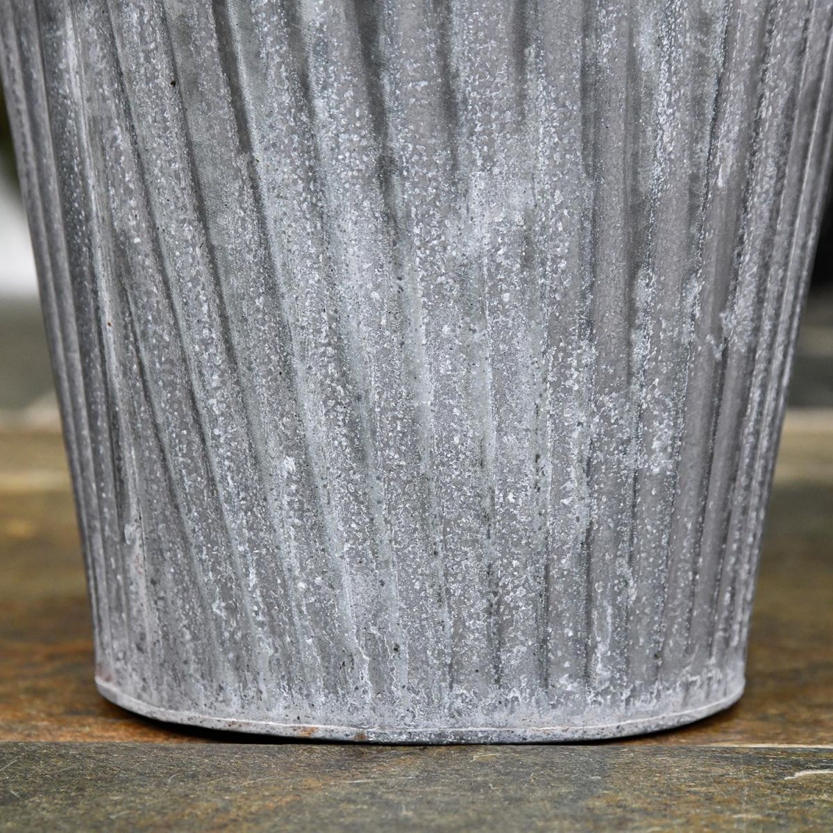 Close-up of the Round Base "The Burley" Steel Vase Log Basket