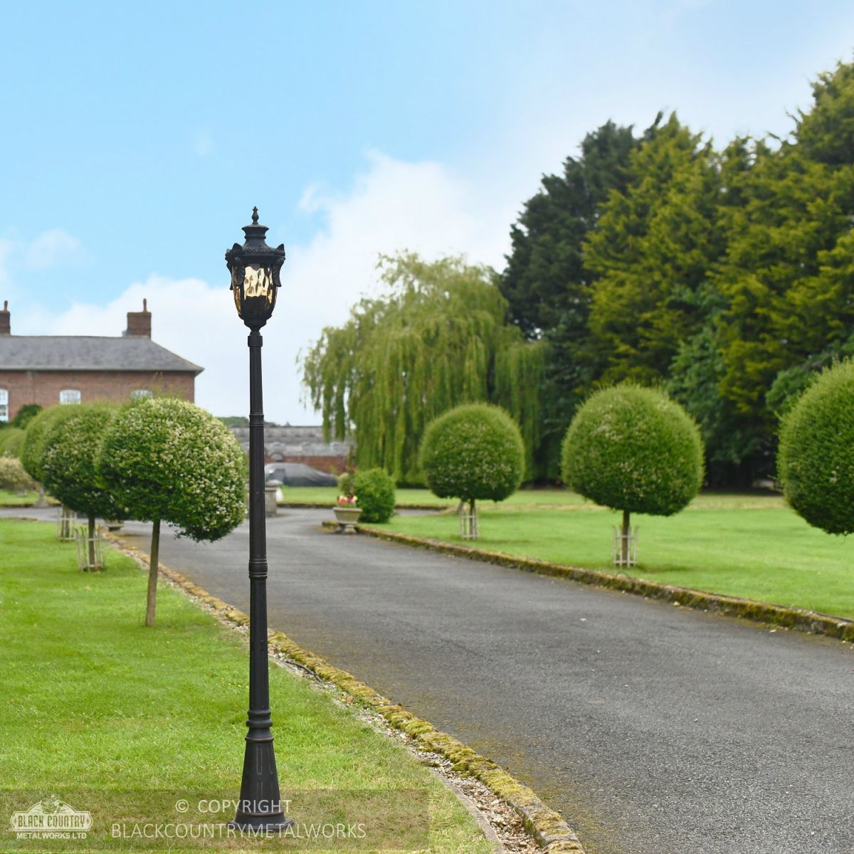 The Elersburg Dark Bronze Fluted Lamp Post Installed On Driveway