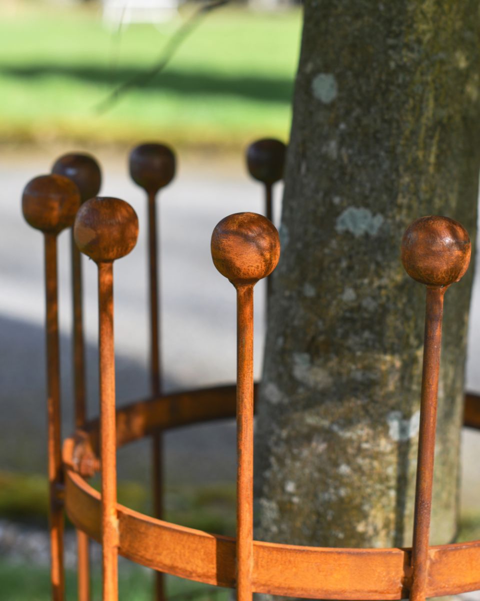 Finials On The Rustic Wrought Iron Tree Guard 
