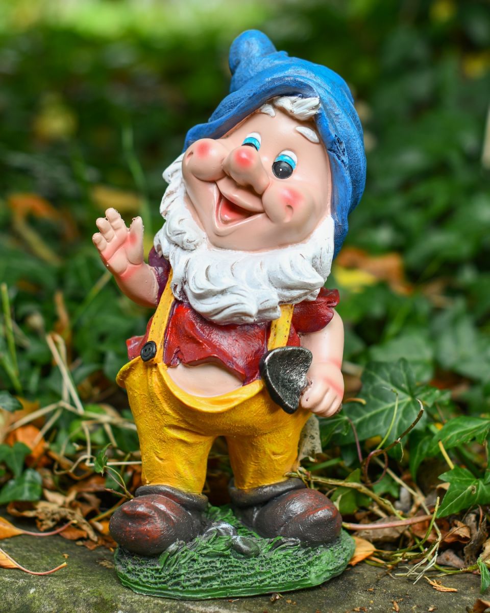Angled view of colourful garden gnome statue