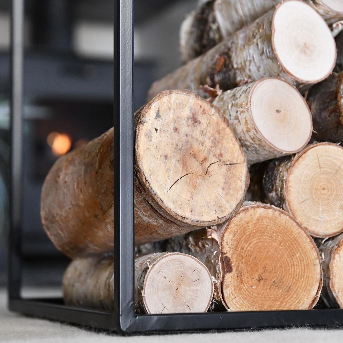 Close-up of the "Town House" Iron Log Rack Holding Logs
