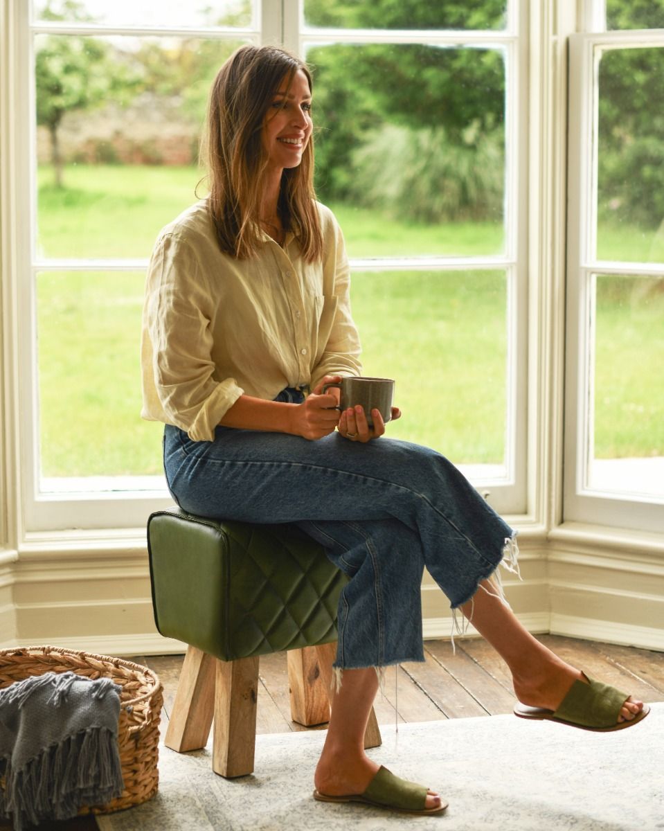 Person Sat on Traditional and Rustic Deep Green Leather Pommel Stool