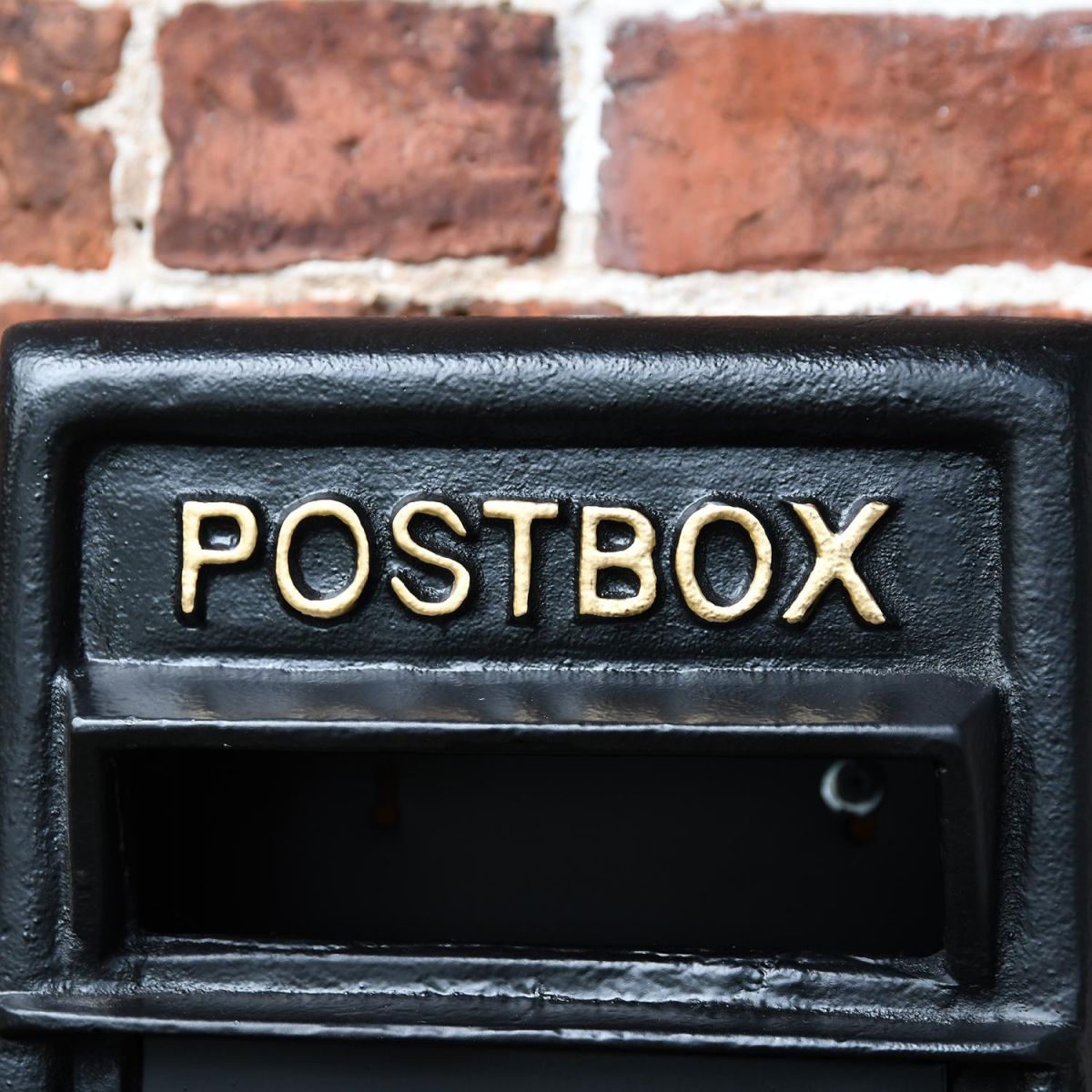 Close-up o fthe Gold Text on the Front of the Post box