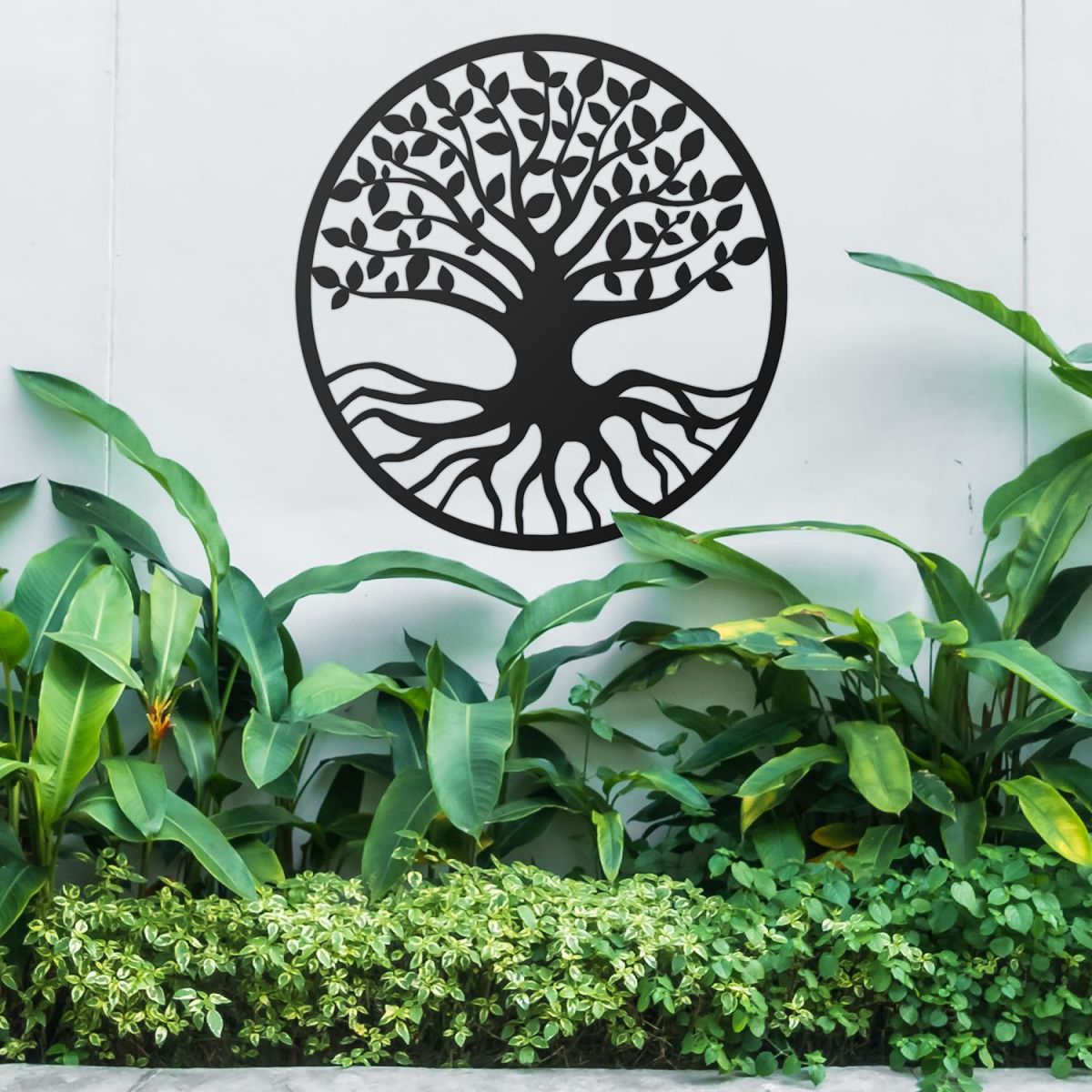 Black Round "Tree of Life" Wall Art in the Garden