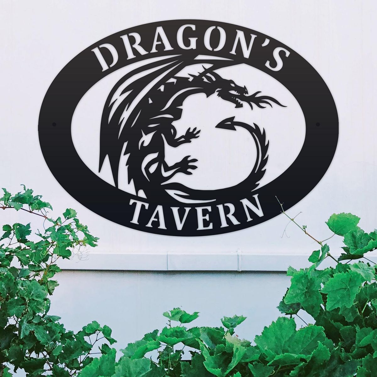 Tribal Dragon Iron Oval House Sign on a White Wall
