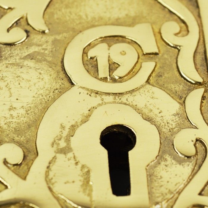 Close-Up Of The Ornate Detailing On The Brass Rim Lock