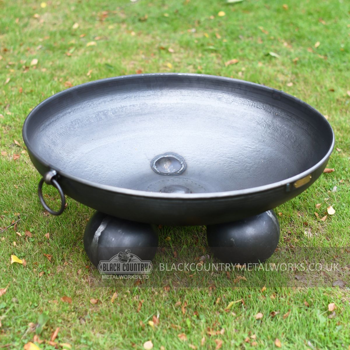 Fire Pit With Ball Feet and wrought iron handles