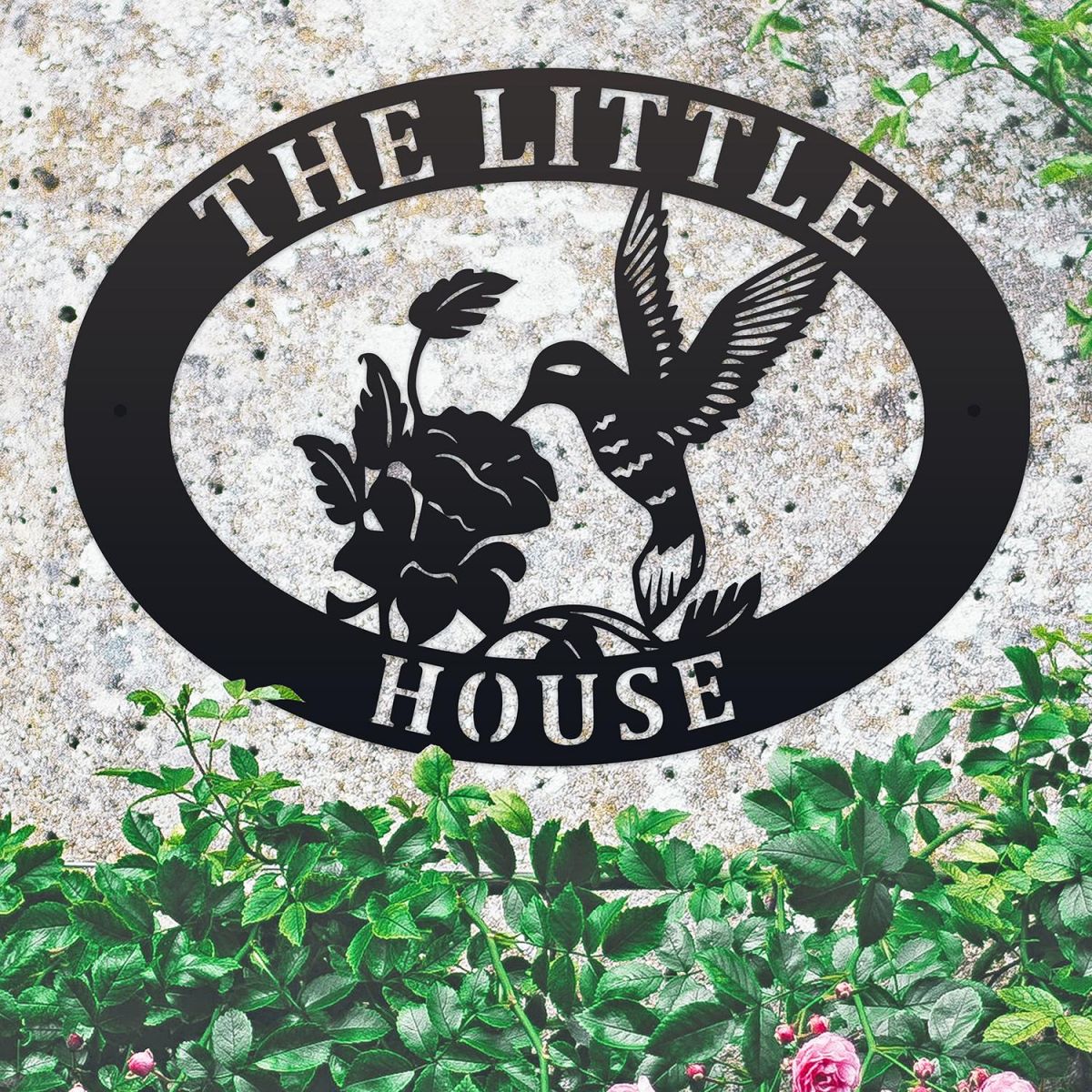 Hummingbird Iron Oval House Sign in situ in a Stone Wall