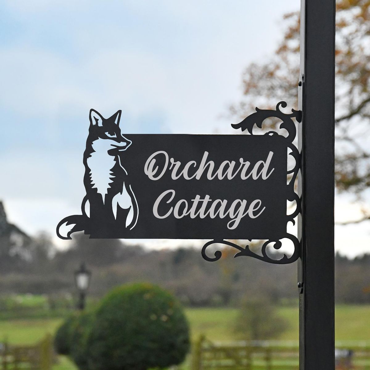 Sitting Fox Iron Bracket Name Sign in Situ