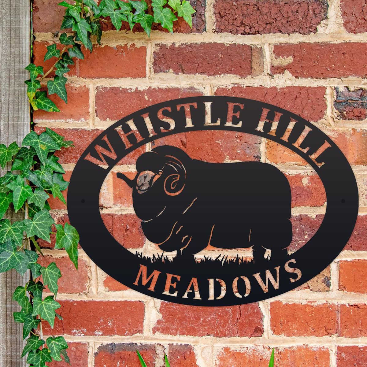Merino Sheep Iron Oval House Sign on a Brick Wall