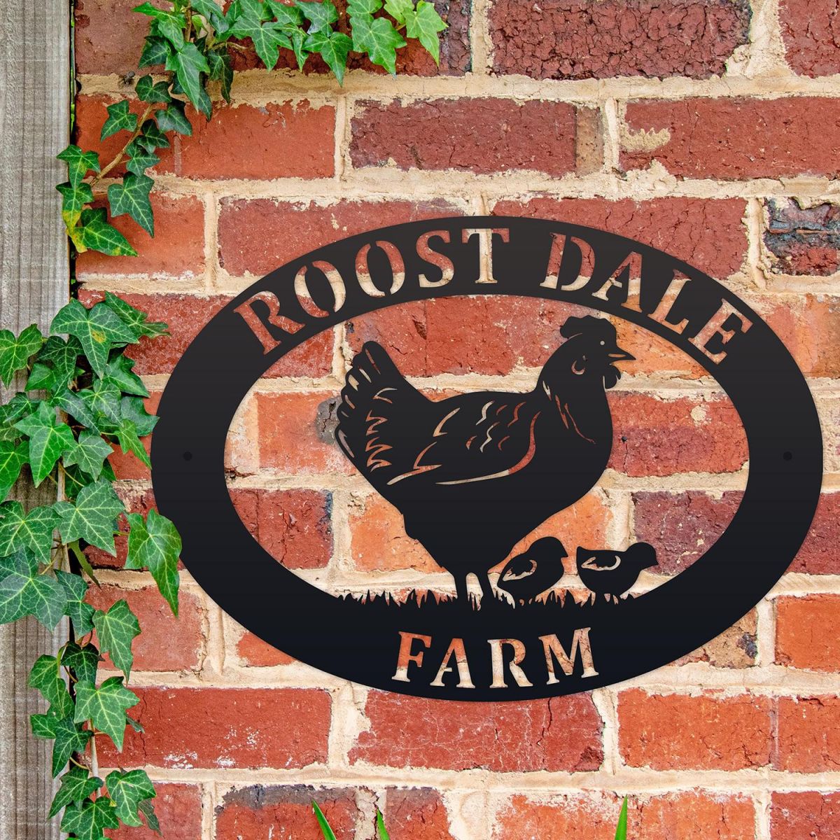 Hen & Chicks Iron Oval House Sign on a Brick Wall