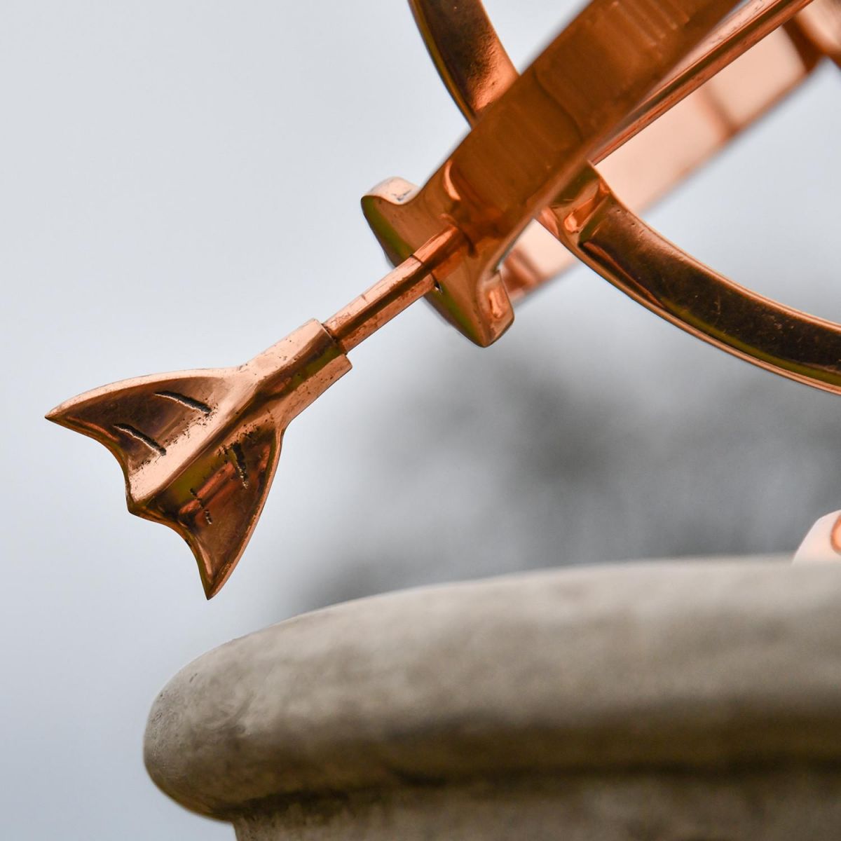 Close-Up of the Base of the Arrow on Polished Copper Armillary - 24cm