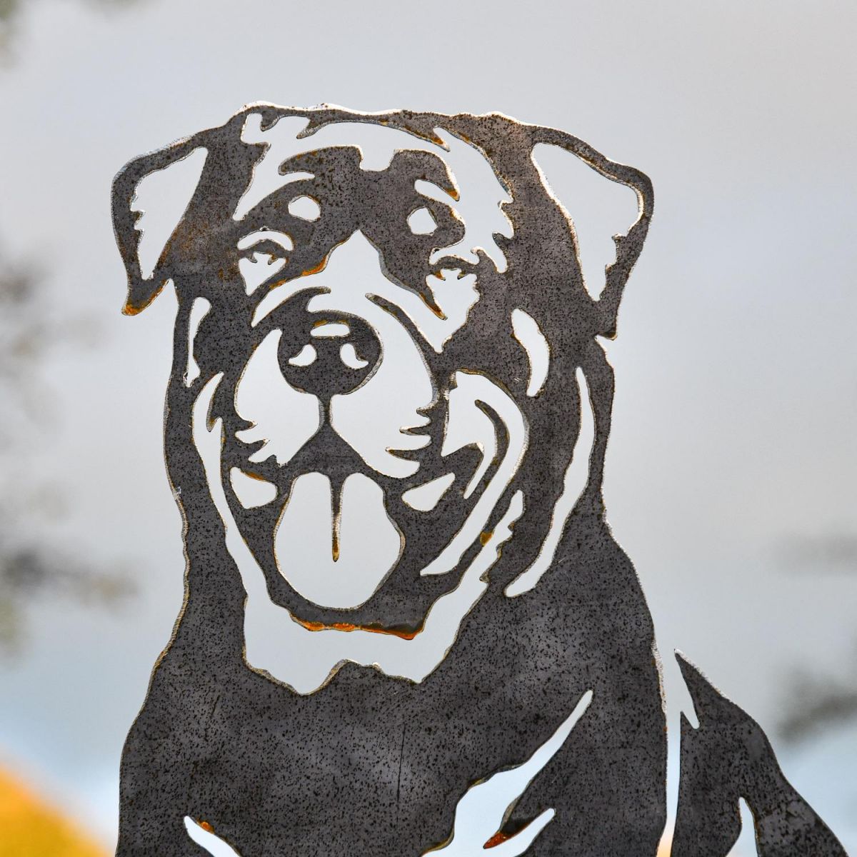 Close up of cut out detailing on unfinished metal silhouette 