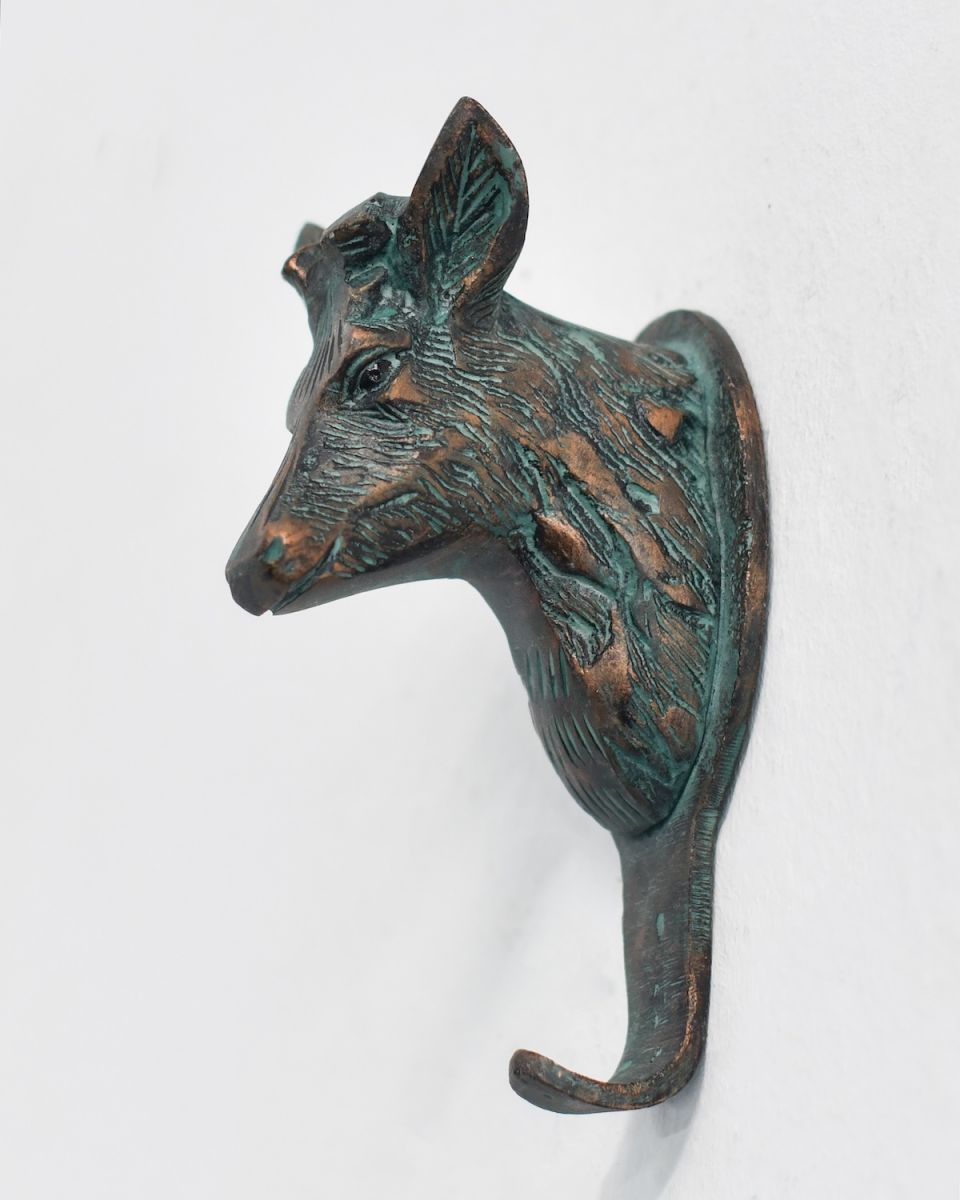 In situ photo of cast aluminium deer bust coat hook