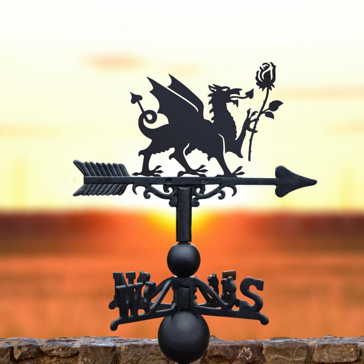 Welsh Dragon & English Rose weathervane at sunset