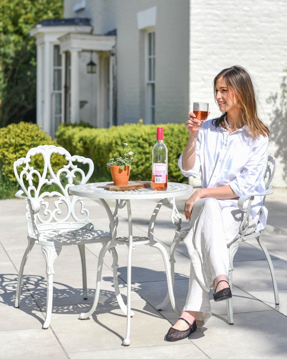 Woman Sat at Garden Furniture