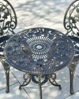 Close up of parasol hole on table top on outdoor bistro set