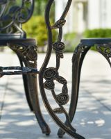 Close up of floral table leg detail on patio bistro set