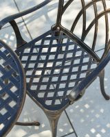 Close up of crosshatch seat detail on outdoor bistro set