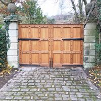 Beautiful Wooden Gates with the "Marlbury" Blacksmith Door Studs