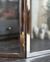 Close-Up of Polished Steel "Strandly Grange" Iron Fire Guard 