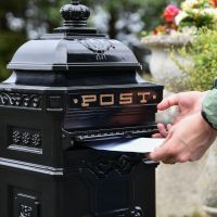 Letter Opening in Use on “Blackberry Harvest” Black Camden Deluxe Free Standing Post Box
