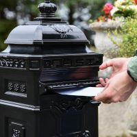Letter Flap on “Raventree” Black Camden Free Standing Post Box in Use