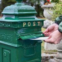 Letter Opening in Use on “Woodland Ivy” Green Camden Deluxe Free Standing Post Box