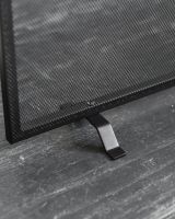 Close up of fine mesh detail on black fire screen