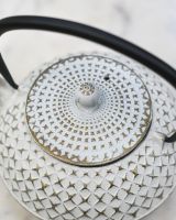 Close up of "Agawa" White Finish Cast Iron Japanese Style Teapot lid